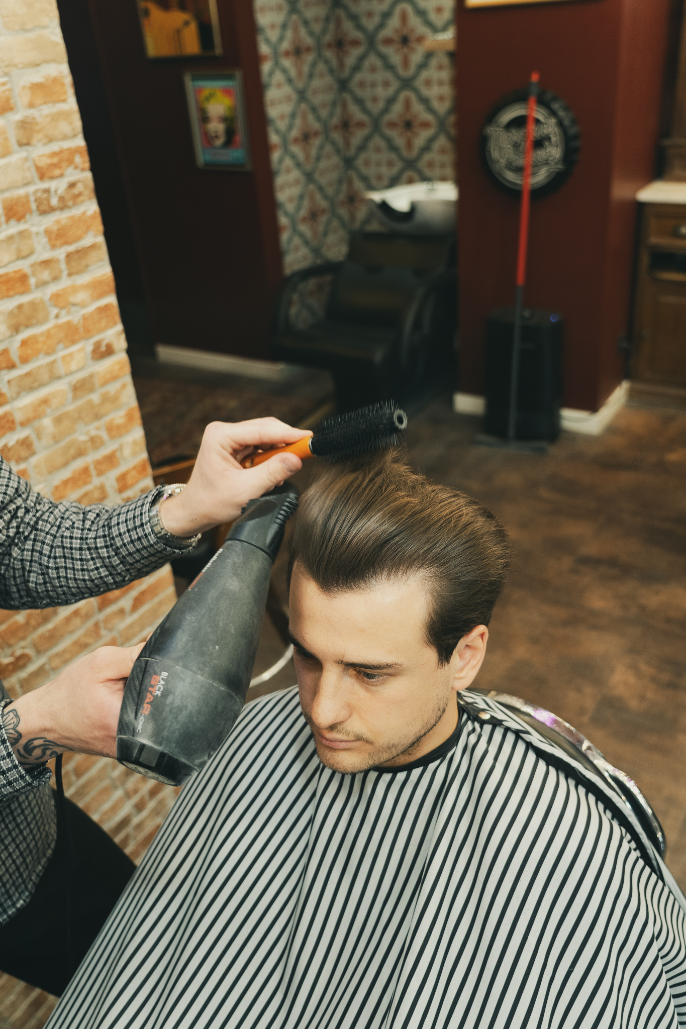 Dégradé américain homme réalisé par un barber professionnel
